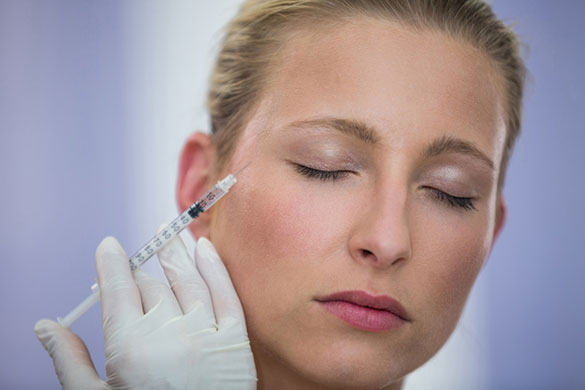 Woman receiving Botox near eyes